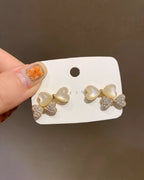 Pearl Bow Kiss Earrings