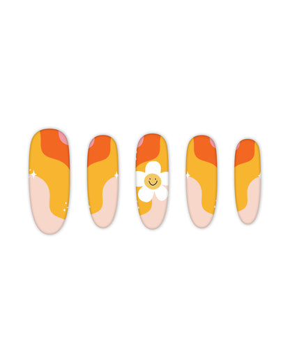 Trendy oval-shaped press-on nails with a vibrant retro wave design in shades of orange, yellow, and peach, featuring a cute smiling daisy accent. Perfect for beauty lovers seeking quick and easy-to-apply fake nails for a fun, summer-inspired manicure.