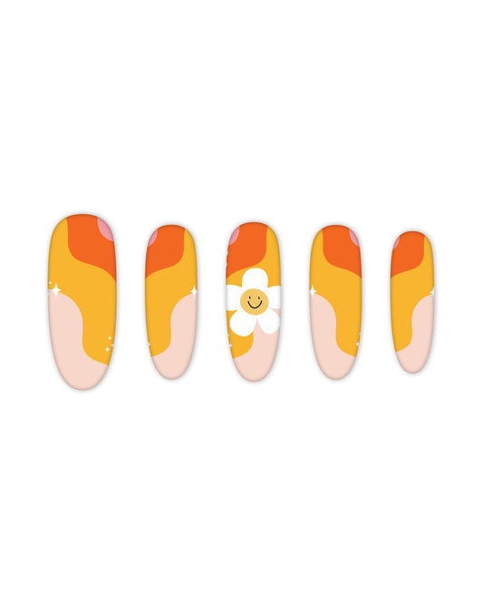 Trendy oval-shaped press-on nails with a vibrant retro wave design in shades of orange, yellow, and peach, featuring a cute smiling daisy accent. Perfect for beauty lovers seeking quick and easy-to-apply fake nails for a fun, summer-inspired manicure.