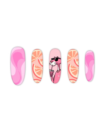 Trendy oval-shaped press-on nails featuring a vibrant pink aesthetic with playful designs: groovy pink swirl patterns, citrus orange slice graphics, and a stylish pink panther character wearing sunglasses and sipping a drink. Ideal for beauty lovers seeking quick and easy-to-apply fake nails with a bold, fun, and fashionable nail art style.